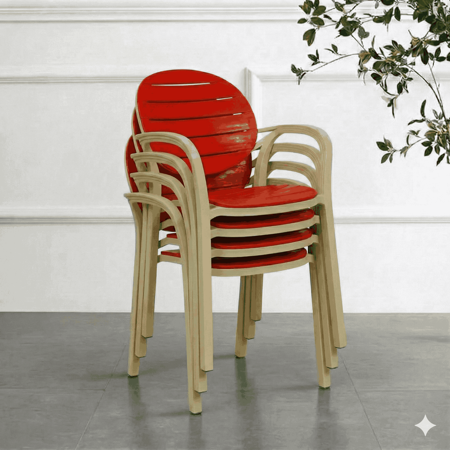 4 red chairs with ash white frames on a gray floor against a white wall.
