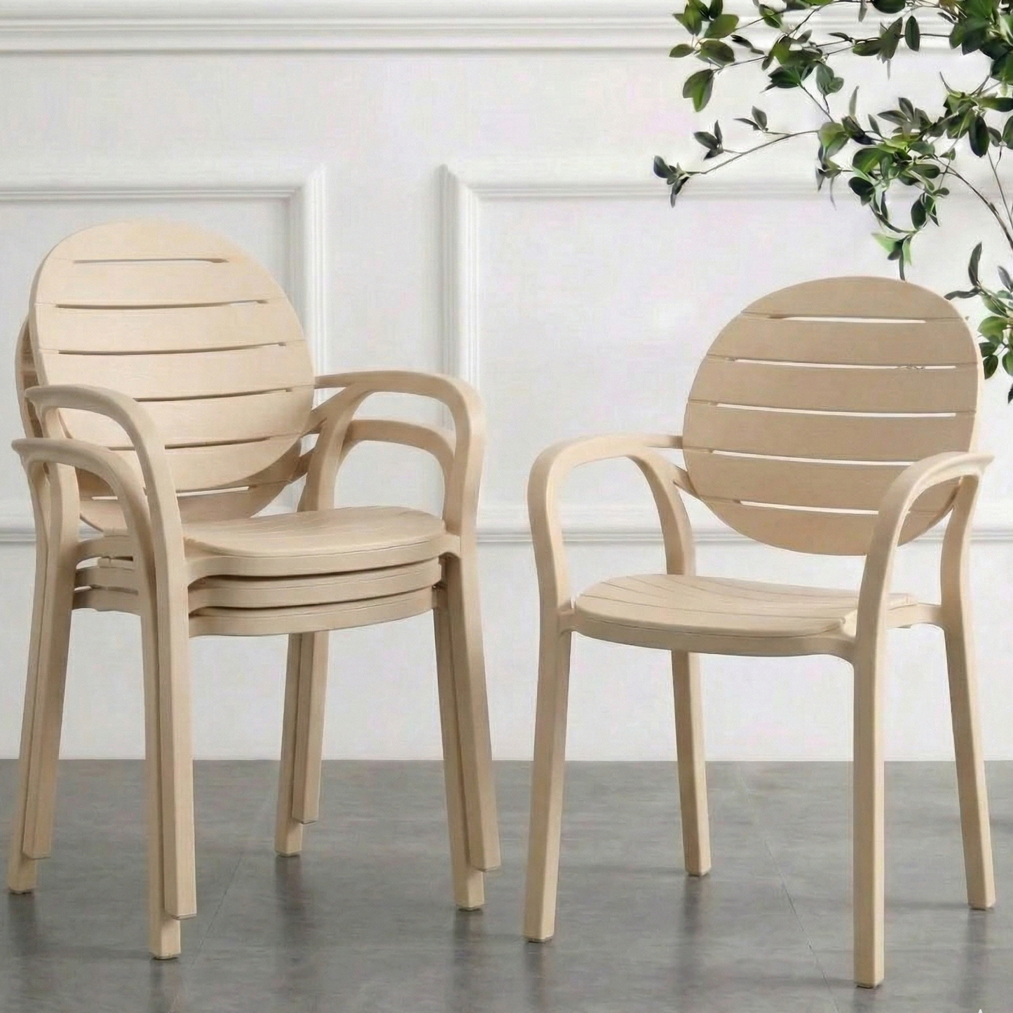Four Ash White chairs on a gray floor with a white wall and plant in the background